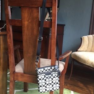 Coach cross-body bag with adjustable strap.